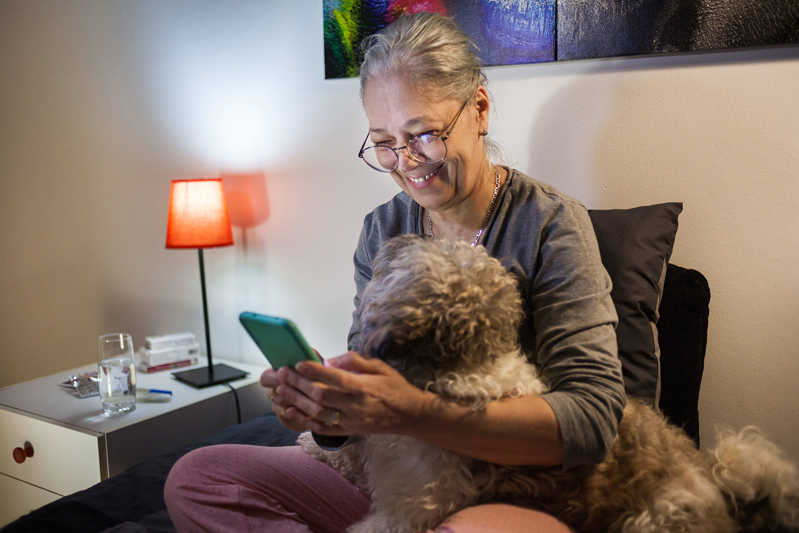 Senior woman using phone in bed Nonni 3